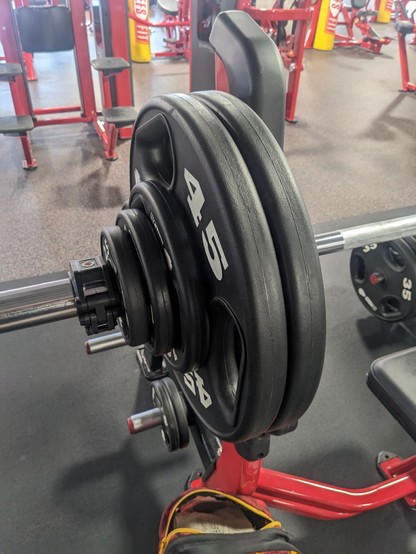 The side of a bench press bar showing 260 pounds in weight.