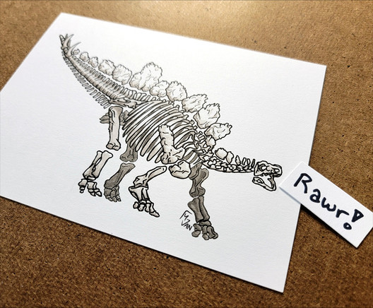 An ink and markers drawing of a full stegosaurus fossil posed with his tail up and his mouth opened, with a smaller piece of paper sitting in front of his face with the word 