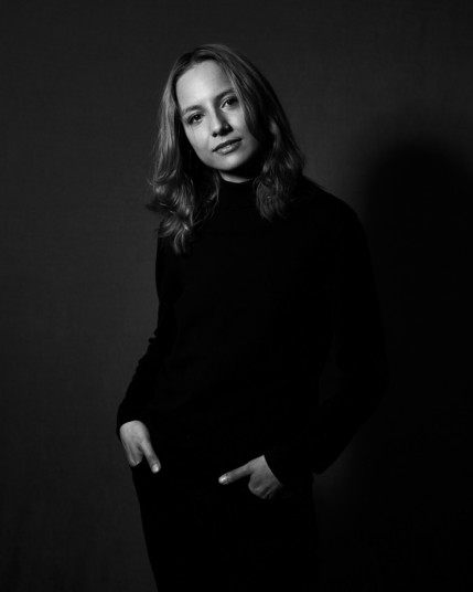 Low key monochrome portrait  of a woman in black