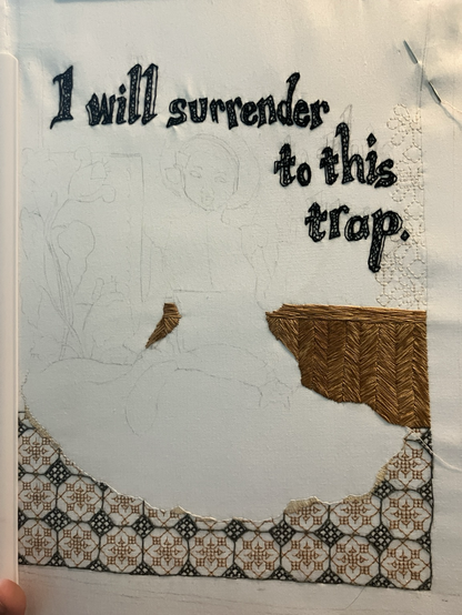 A partially embroidered picture of a girl preparing to pet a cat’s belly, with ‘I will surrender to this trap’