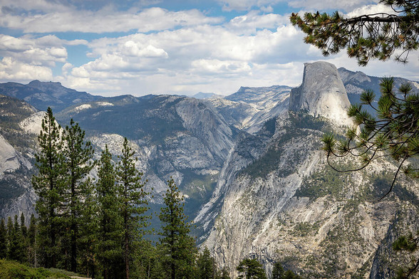 Breathtaking view of Yosemite Valley from Sentinel Dome, showcasing iconic granite cliffs, forested slopes, and the vast wilderness of one of America's most beloved national parks. 