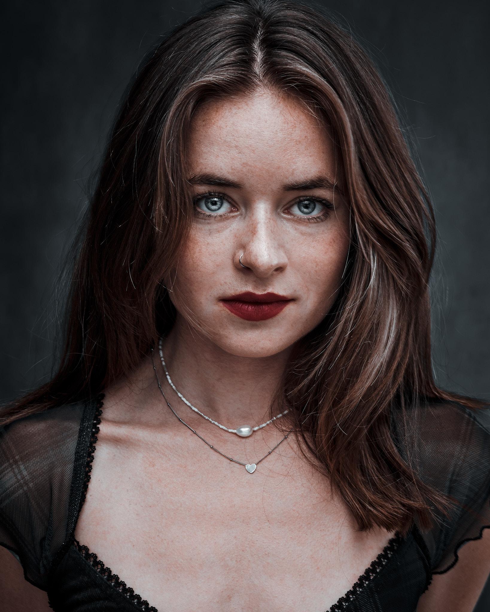 Woman staring straight at you.