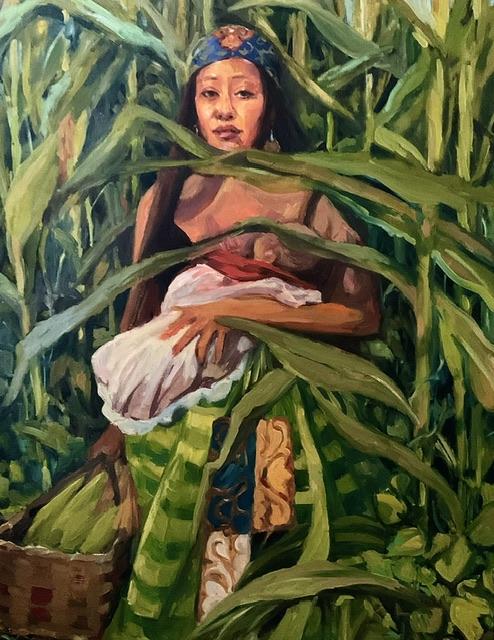 Portrait of Winona, a Kickapoo Bear Clan young mother wearing her ribbon skirt and standing in a cornfield holding her infant in one arm, & carrying a basket of corn in the other.