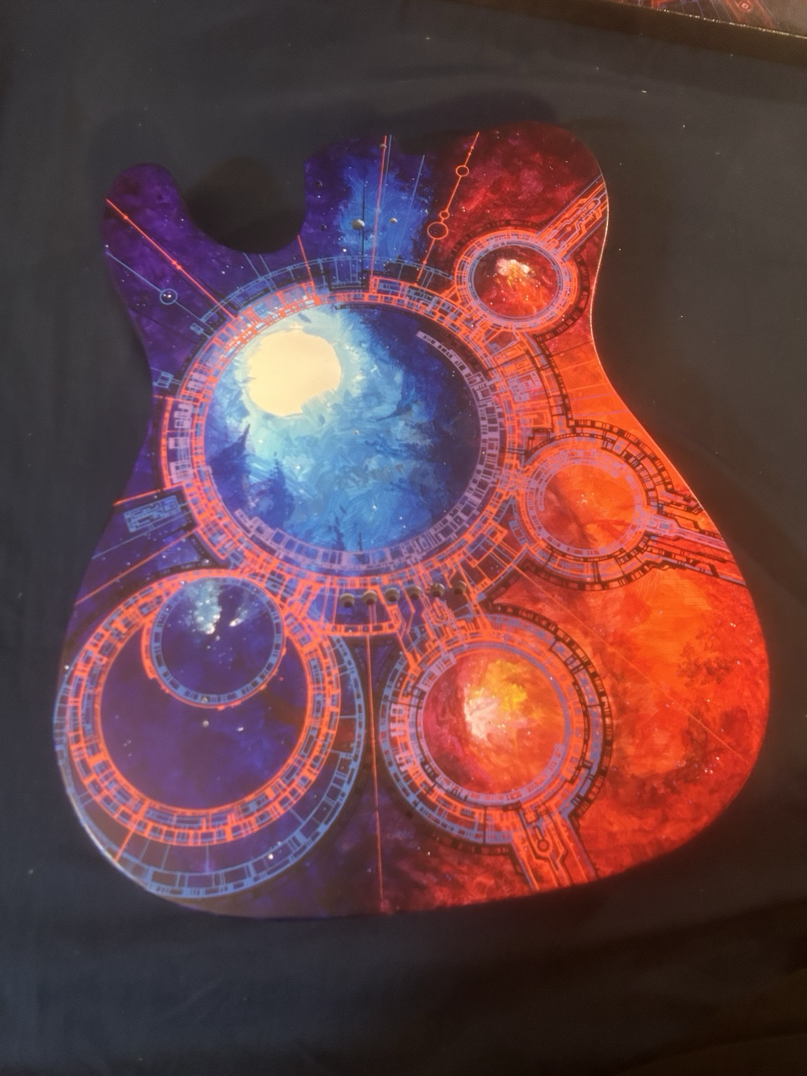 Back of Tele similarly graphic-ed up in  reds and blues