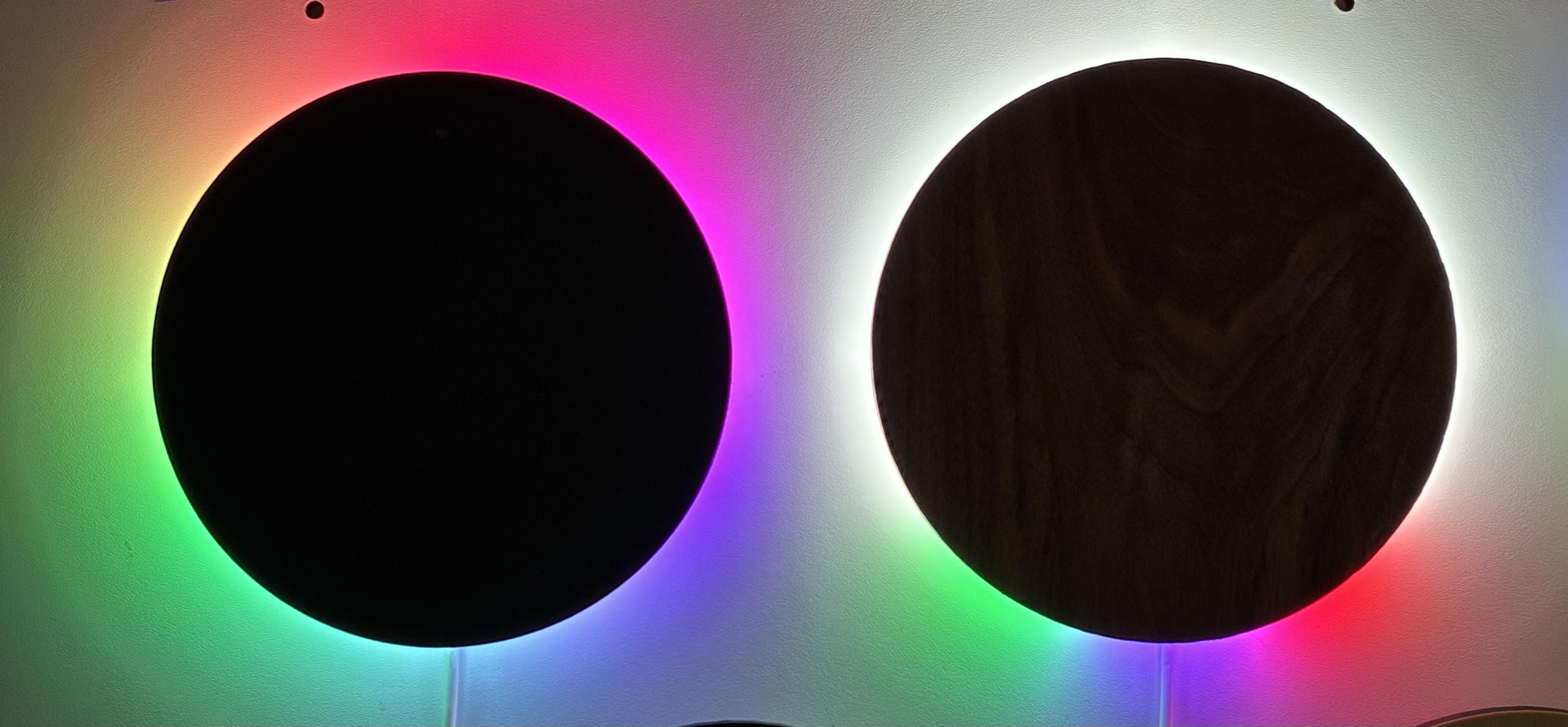 Two black circles with bright LED lights; they're halo clocks.