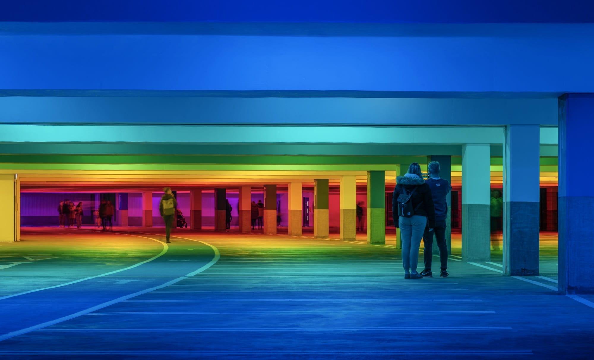 chromatic light blankets a parking garage by Liz West