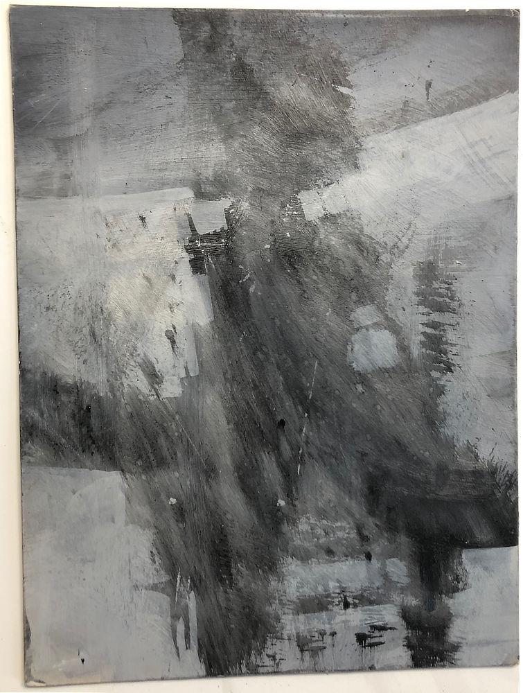 Photograph of paint marks on illustration board. Dark smears angle upward forming the basis of the space station with the curve of a planet at the top of the panel.