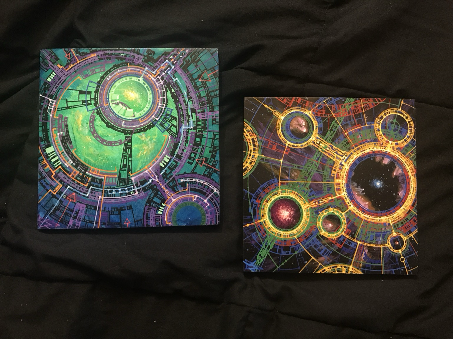 Two square Geometron paintings, left one is green dominant with orange/purple, right is yellow graphics dominant over multicolored dark space BG with multiple stars and nebulae
