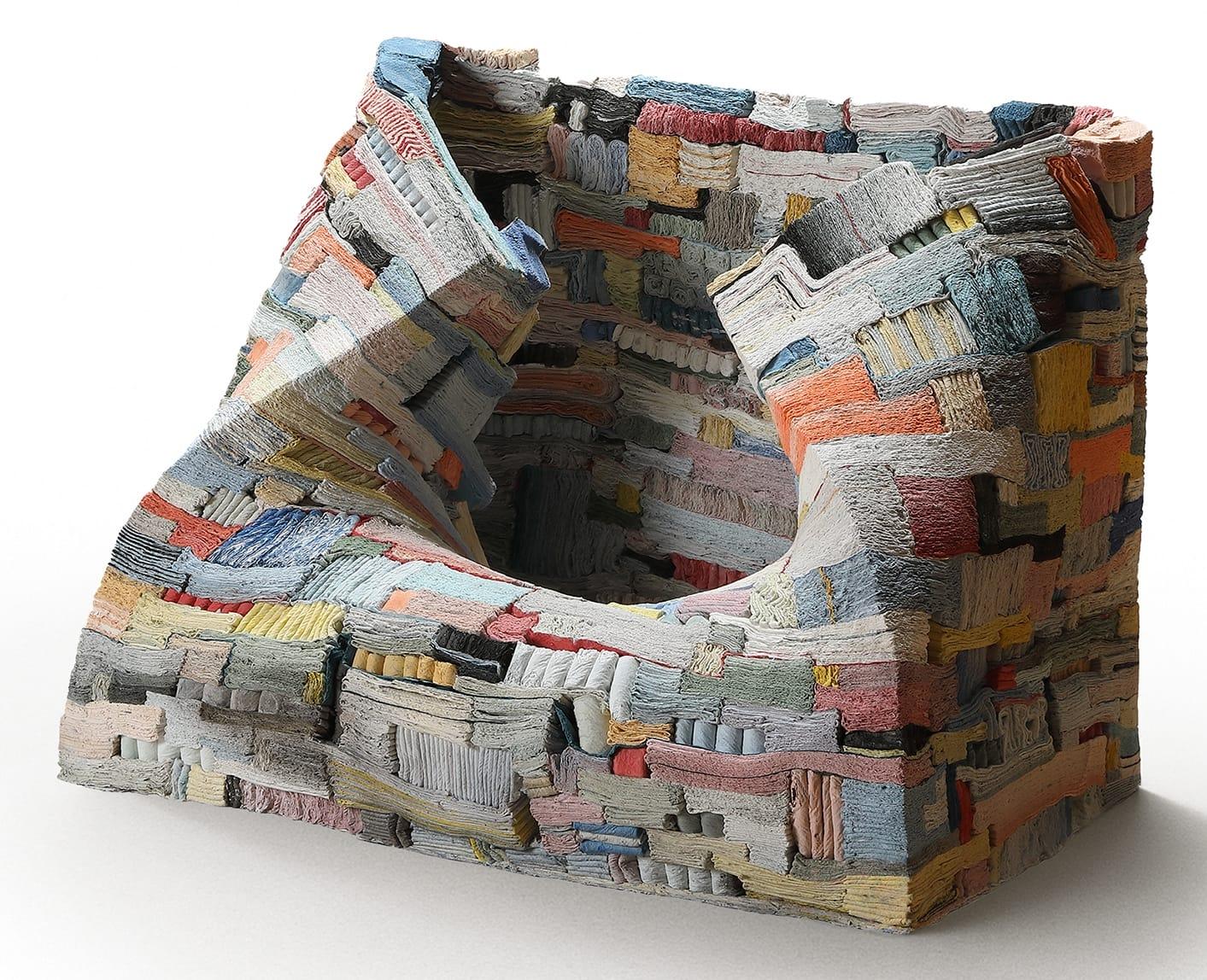 a square sculpture made of layered and folded slip by Jongjin Park