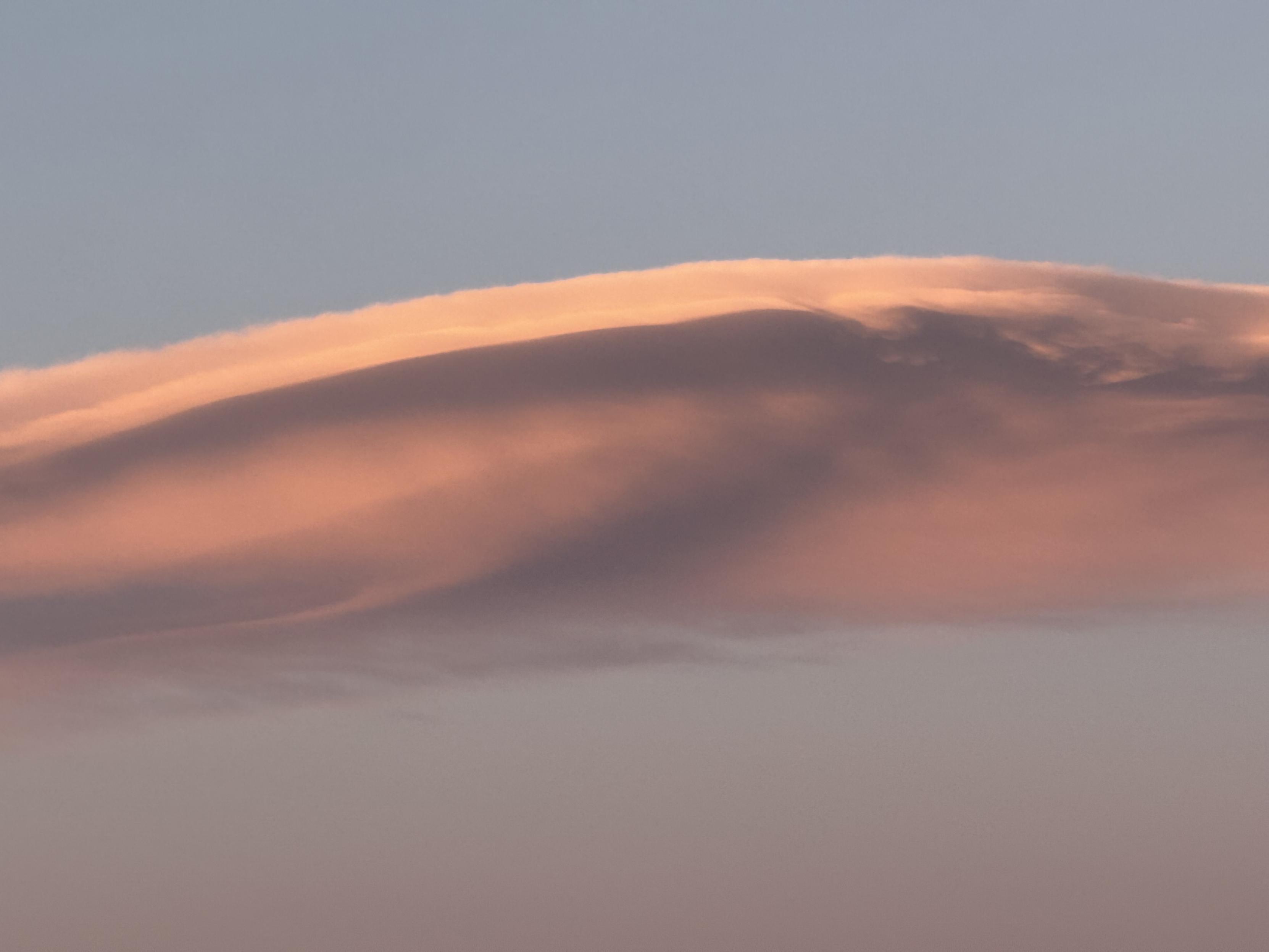 A detail of the giant lenticular cloud that is illuminated by the setting sun. It reminds me of a whale.