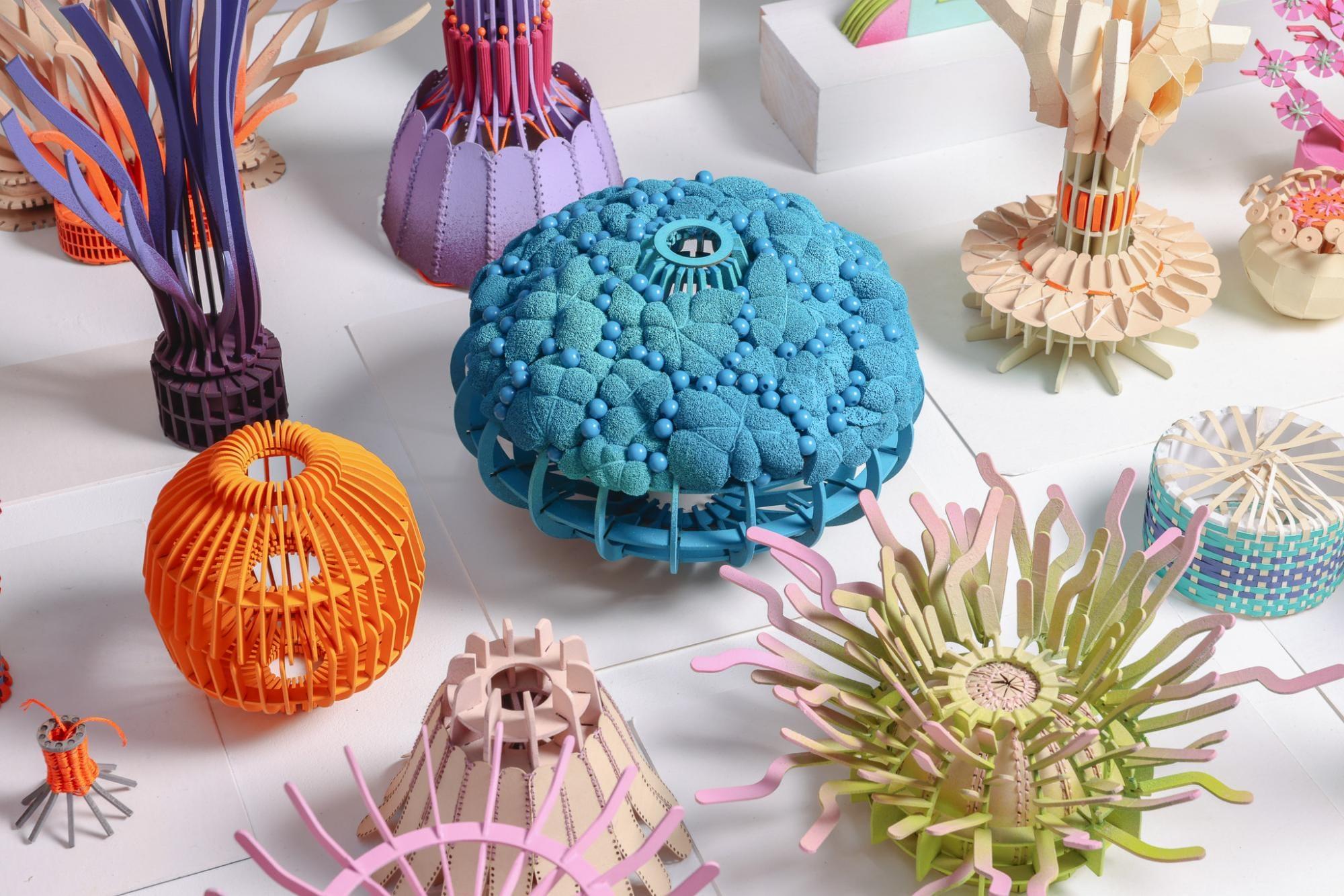 Elaborate embroidered paper sculptures by Diana Beltrán Herrera depicting several types of corals