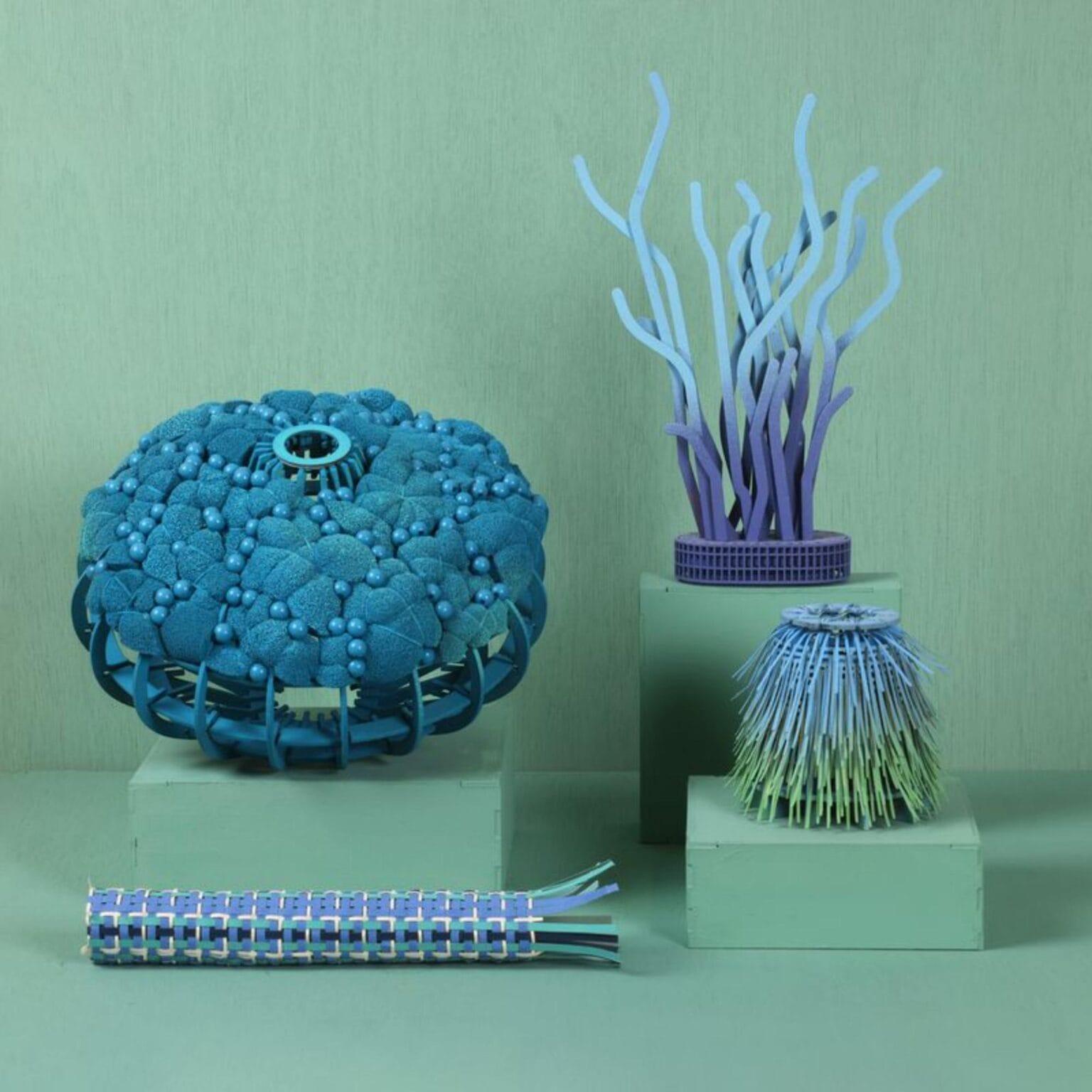 An elaborate embroidered paper sculpture by Diana Beltrán Herrera depicting four types of corals