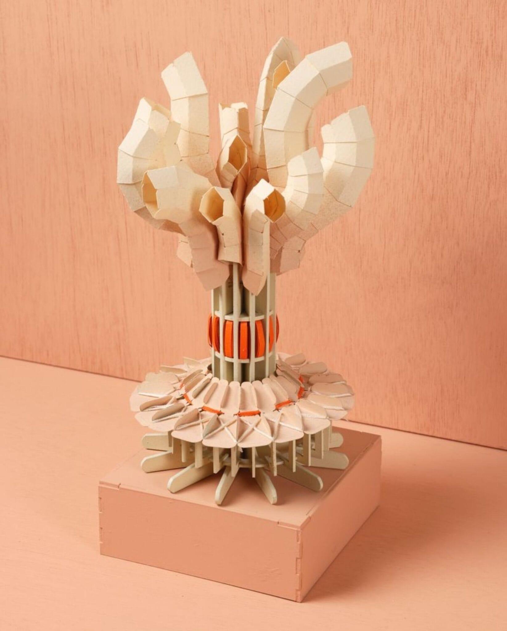 An elaborate embroidered paper sculpture by Diana Beltrán Herrera depicting a coral