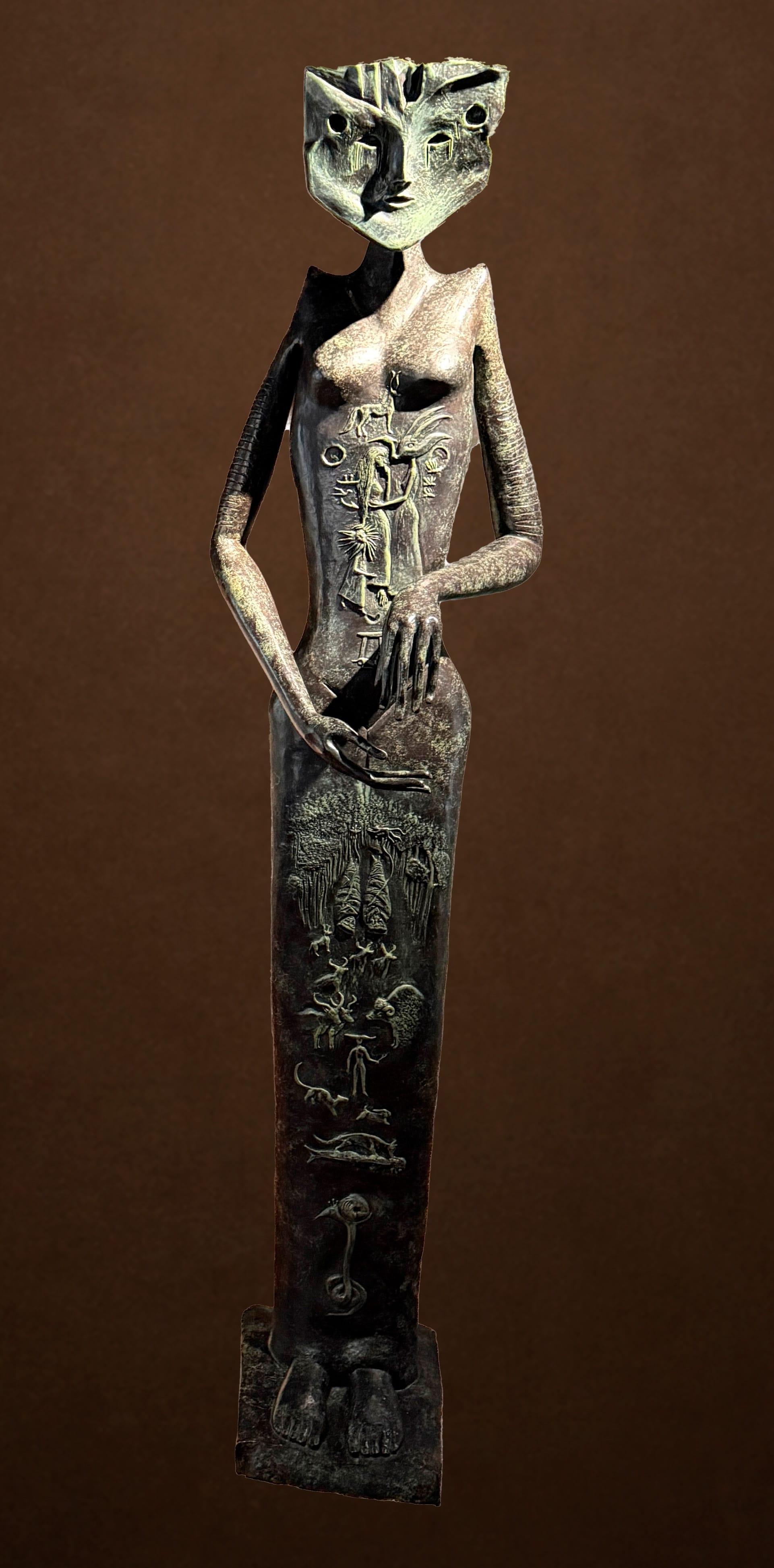 a bronze sculpture of a female figure with a cat-like face
