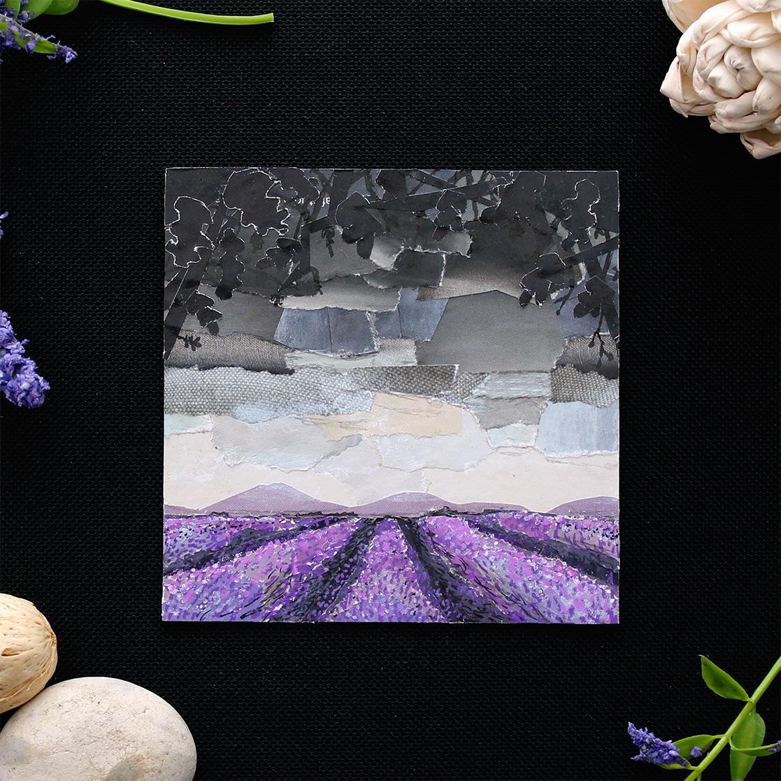 Ace Pride Flag artwork photographed on a black background surrounded by decorative flowers and stones.