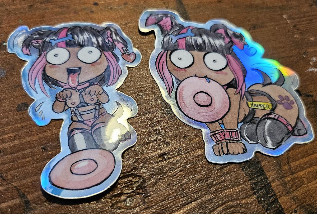 Two puppy girl stickers that are holographic and very cute