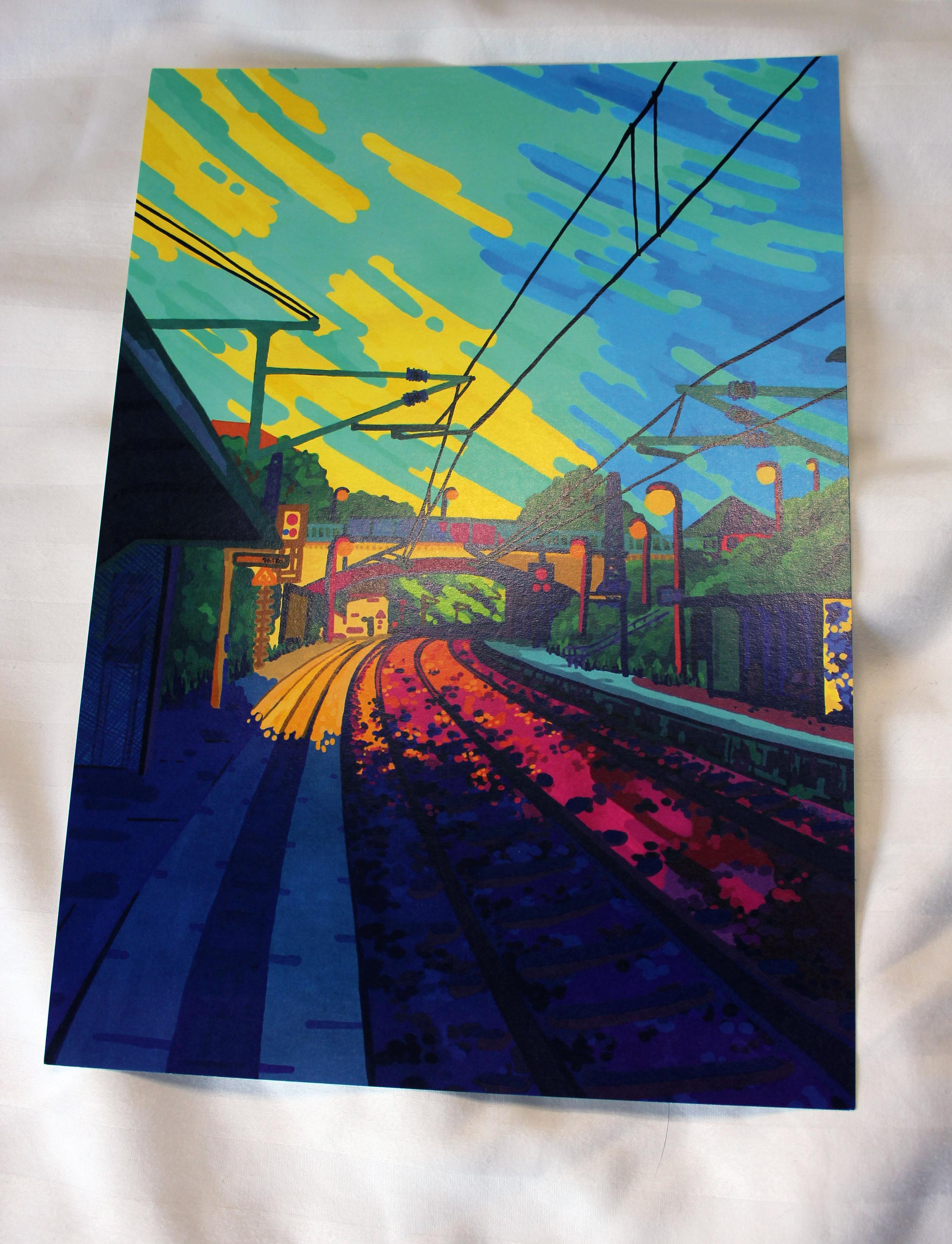 A photo of a print of 'Coppiplatz Bahnhof', one of my Gouache paintings. It is a very colourful painting of a railway, a bridge and a dynamic sky.