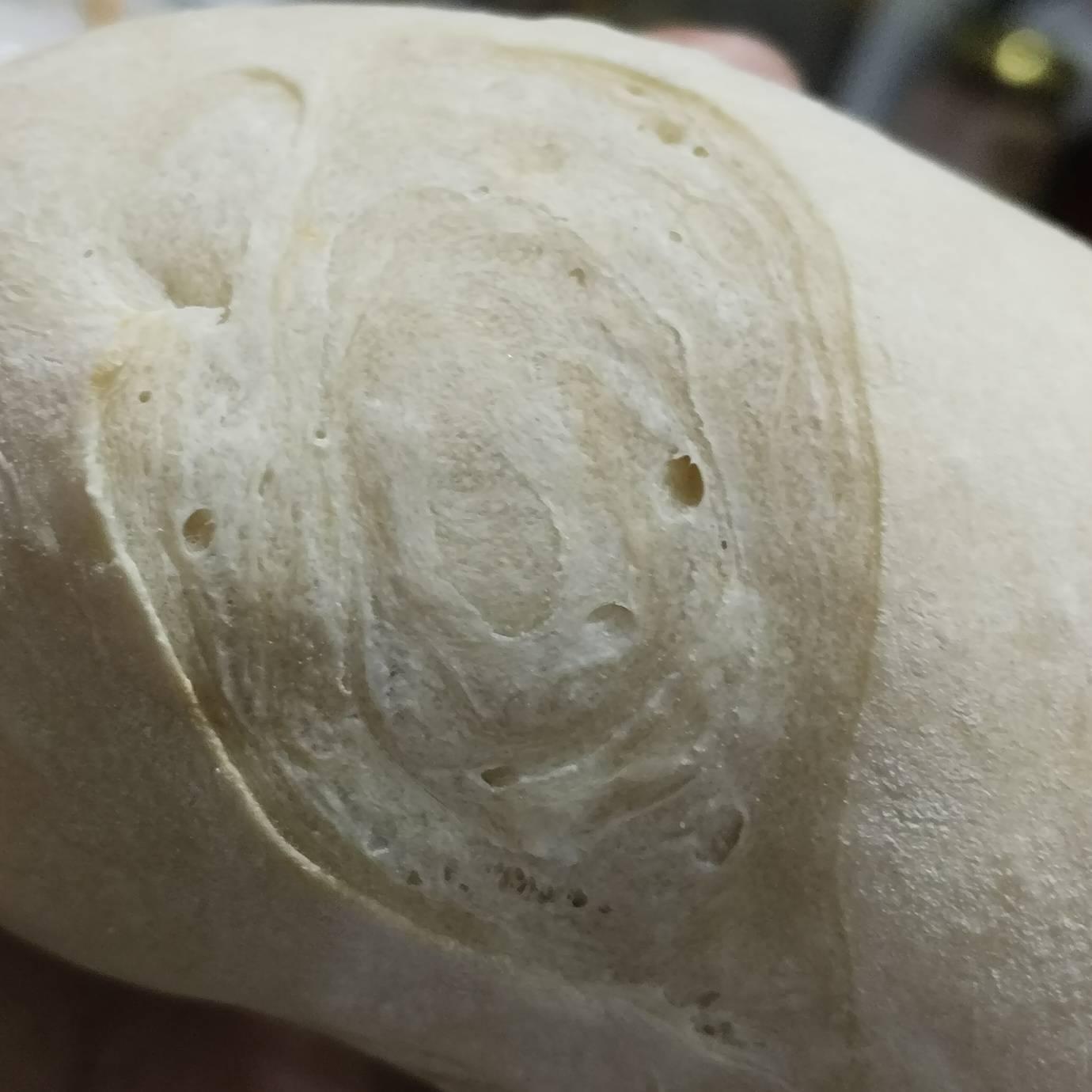 close up to a spiral-ish shape on the scoring