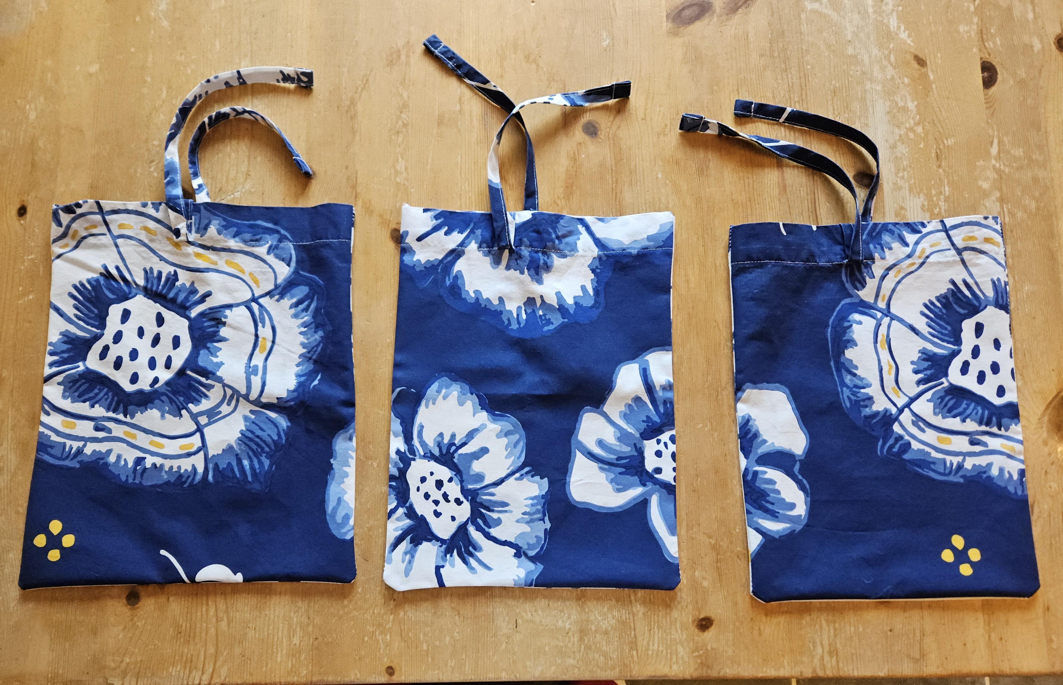 Three bags made out of a leftover piece from an IKEA duvet cover.