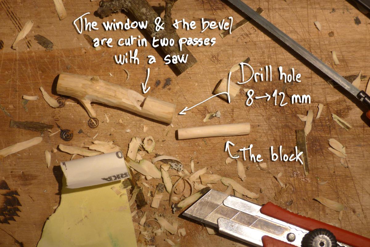 Whistle currently being made: the window & the bevel are cut in two passes with a saw. Drilled hole diameter: 8 to 12 mm. The block is a cilinder that have the same diameter as the hole.