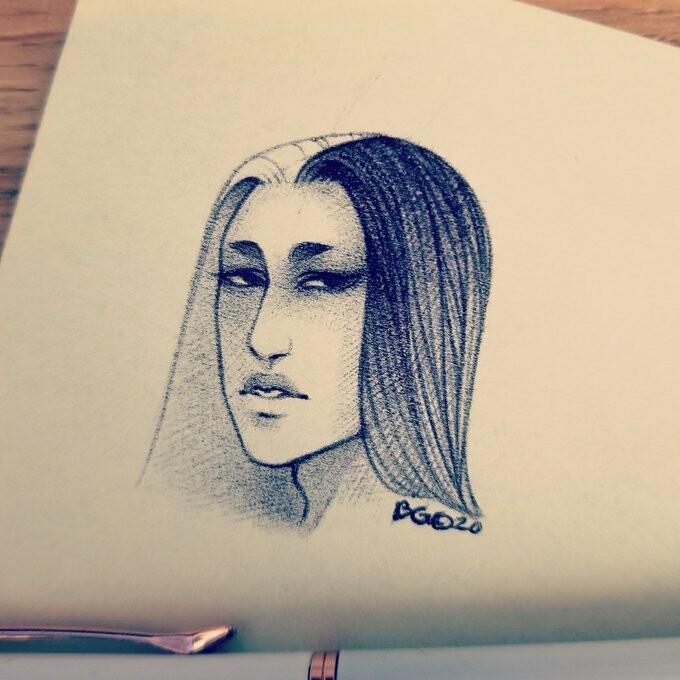 Ballpoint sketch of a humanoid character with an aloof expression. Done on a sticky note, pen visible at the bottom.