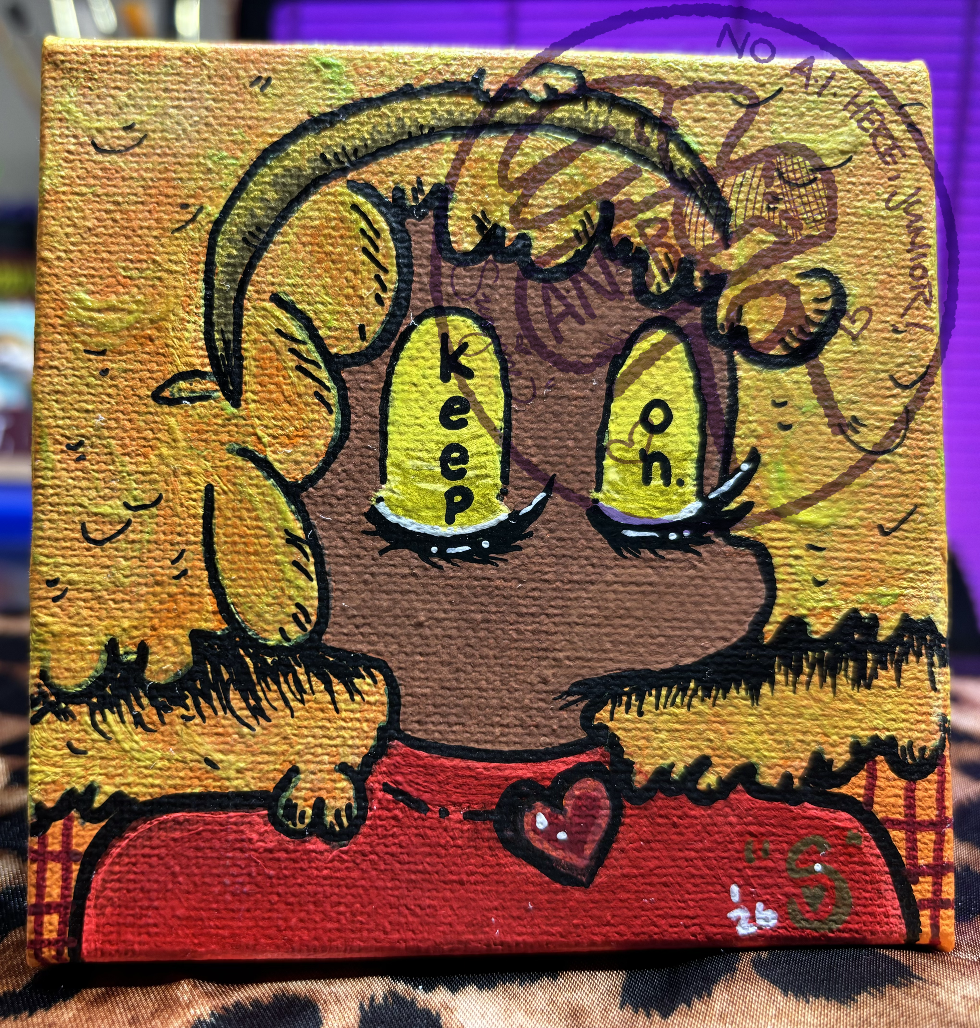 small painting of a brown-skinned character with both of their eyes closed, the words "keep on." painted in black on their yellow eyelids. they are wearing an iridescent yellow-orange fluffy hat on their head and a bright red mock turtleneck with a small red heart-shaped brooch pinned on the collar.