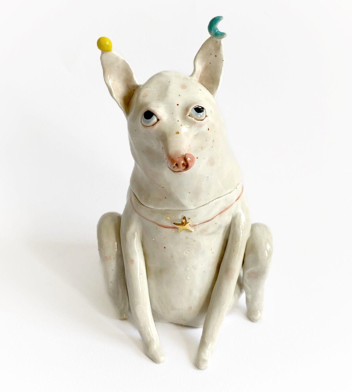 a ceramic sculptural jar in the form of a cartoonish small dog