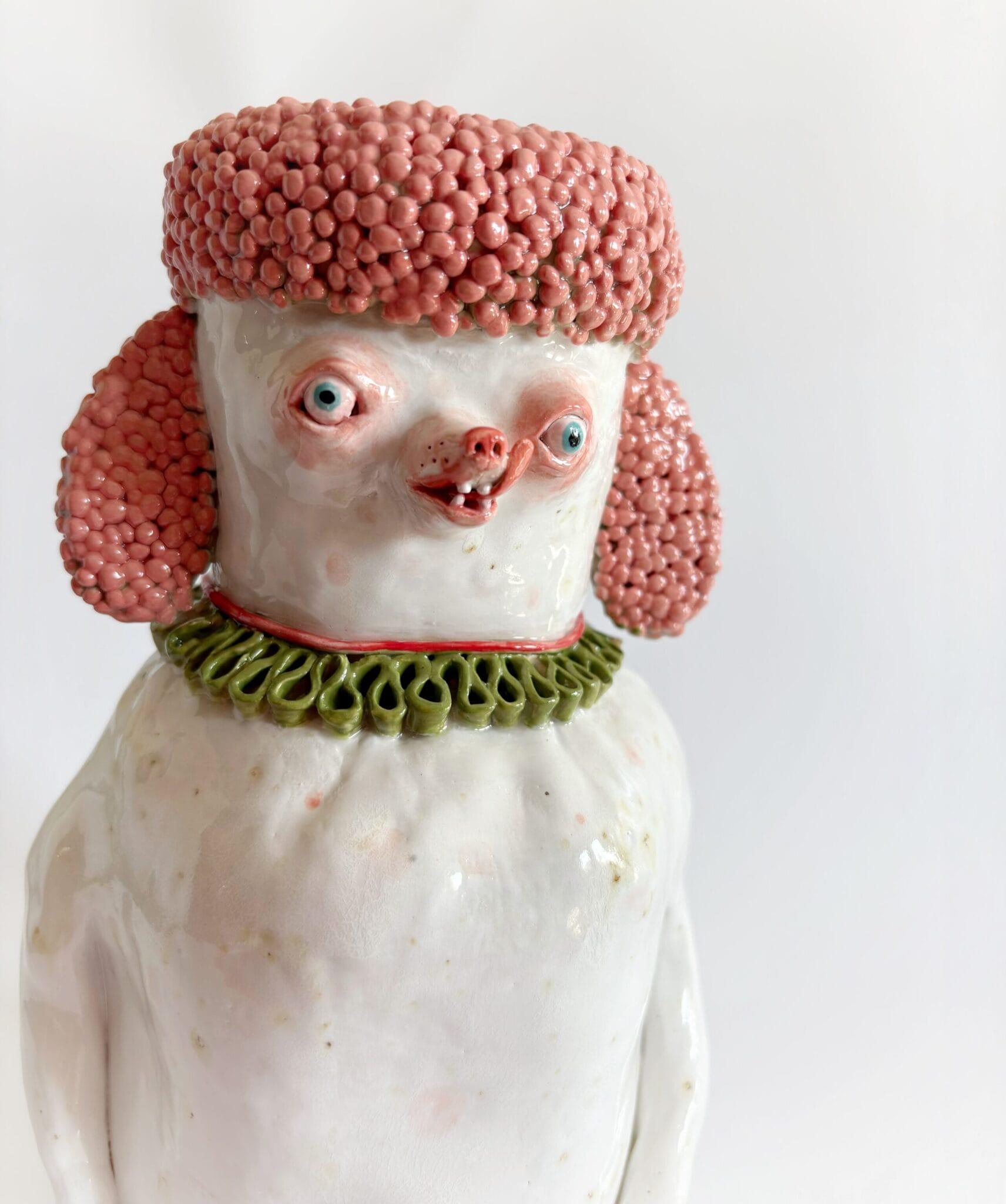 a ceramic sculptural jar in the form of a cartoonish small dog