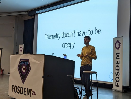 Will in front of a presentation that reads, “Telemetry doesn’t have to be creepy”