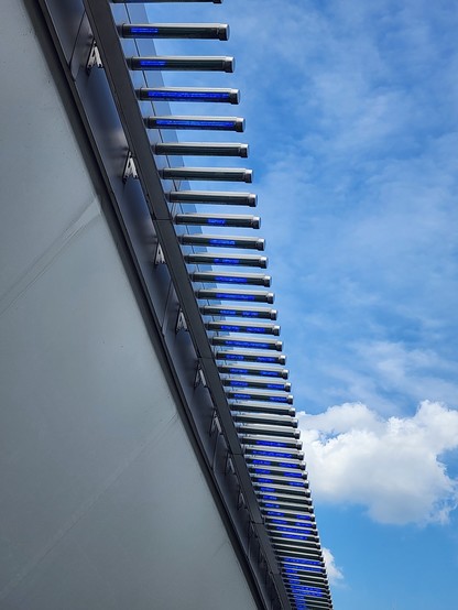 LED lights showing some letters scrolling on the top of the building.