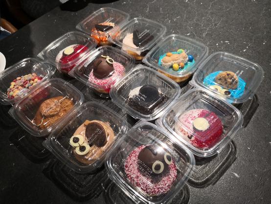 A picture featuring a variety of lovely donuts from local shop Dungeons and Doughnuts.

They are absolutely delicious and even though some of them have faces no they don't scream in agony when you eat them don't ask me how I know that.