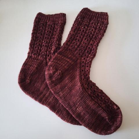 Lace socks in a reddish brown yarn
