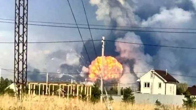 Smoke rises over the site of reported explosions at a Russian weapons arsenal in Vladimir Oblast on April 22, 2025