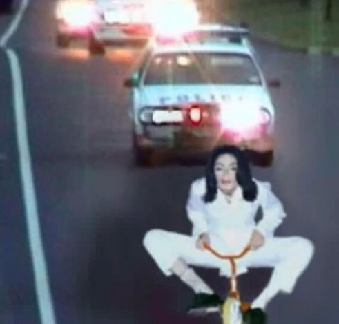 Mockup photo of Michael Jackson on a tricycle being chased by police cars in a parody of the O J Simpson chase.