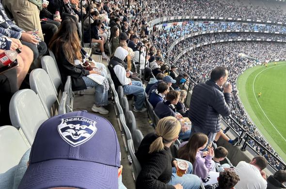 Aussie rules football stadium with audience, selfie taken by me with a Geelong cats hat on