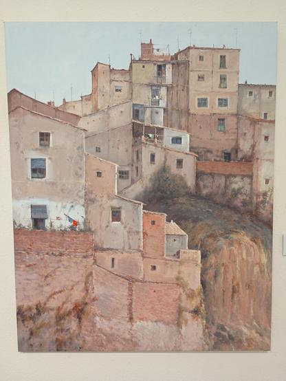 Pintura que refleja edificios humildes en tonos marrones y ocres