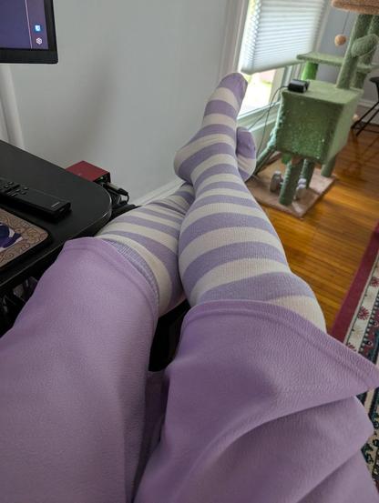 My legs in a lavender skirt with white/lavender thigh high socks