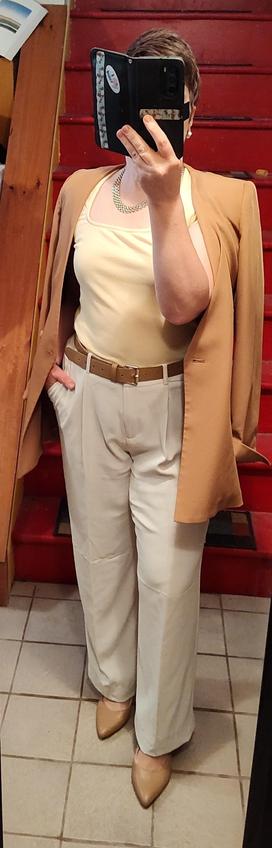 Butter yellow sweetheart neck T, white satin trousers. Camel blazer, belt, slingbacks. Wide gold chain necklace.