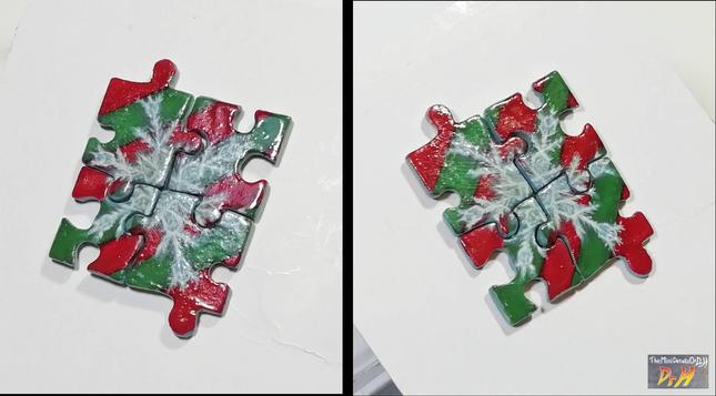Four jigsaw piece earrings joined together to form a picture of a snowflake.