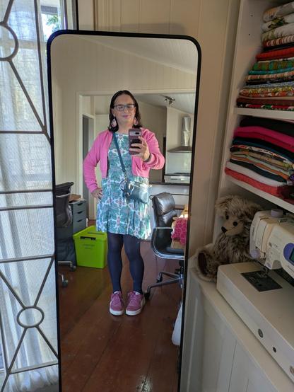 Mirror selfie of me wearing the outfit in the flat lay.