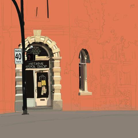 The Beehive Wool Shop sits at a street corner with its main entrance cut out of what would be the corner of the building. Tonight I coloured in the arched window that is around the corner from the entrance. One can just see the back end of the word "yarn" on the glass.