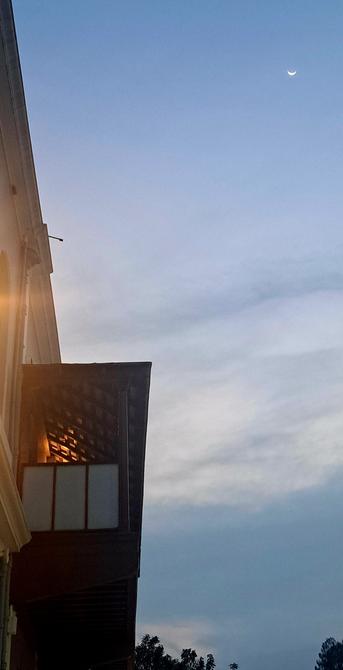 Crescent moon and the blue skies. And the view of the Mother's balcony.