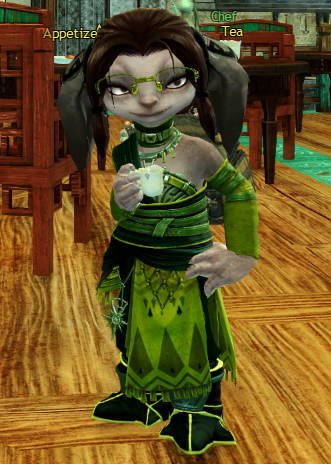 With her hand still on her hip she looks off to the side, with a mellow smile on her face and half-closed eyes.