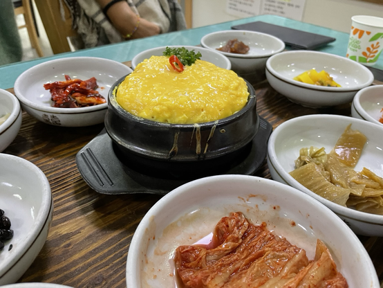 Our banchan for the bi bim bap with a large bowl of baked eggs