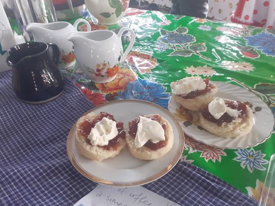 Scones with jam and cream on nice crockery