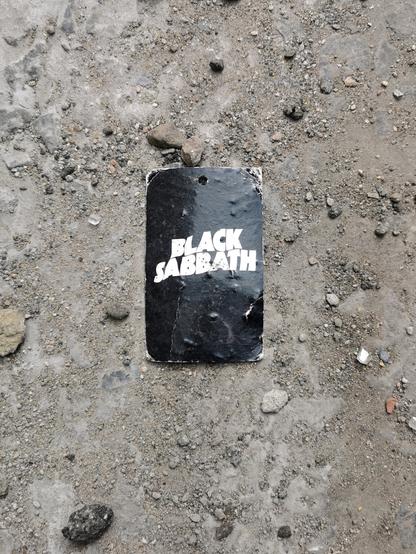 Litter. A cardboard tag for Black Sabbath band merchandise.