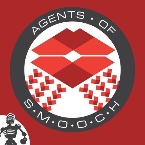 The image is a red background. A circle of black is in the middle and around the edge of the circle says, “Agents of Smooch.” There is a small image of a robot in the lower left hand corner.