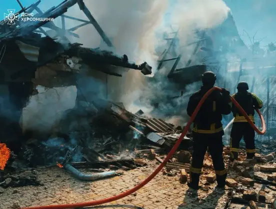 Firefighters extinguish a blaze at a house set by a Russian drone attack on Kherson, Ukraine, May 3, 2025