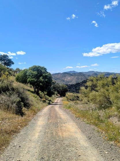 A gravel road going downhill