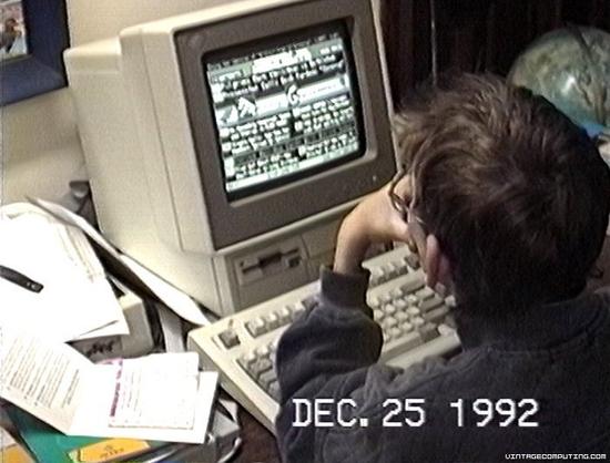 A young person with glasses is seated in front of a vintage computer, focused on the screen displaying text. The date "DEC. 25 1992" is visible at the bottom of the image. Various papers and objects are scattered on the desk

 (online service), pictures by Benj Edwards.

https://www.vintagecomputing.com/index.php/archives/932
